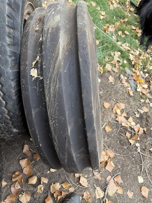 11.00-16 implemented tire. Cut in the side and sitting in store forever ...